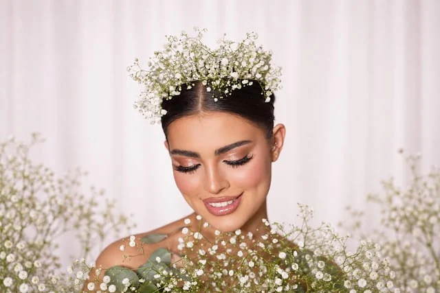 Soft pink makeup framed by white flowers