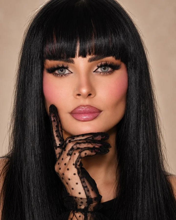 Dramatic evening makeup with defined eyes and glossy pink lips