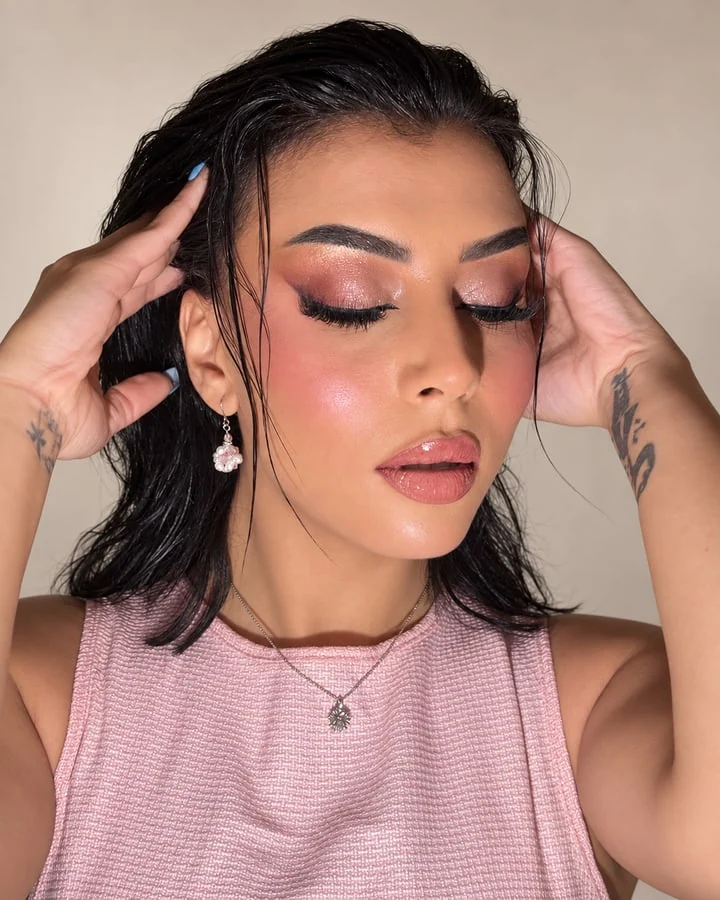 Rose-toned occasion makeup with shimmering eyelids and glossy lips