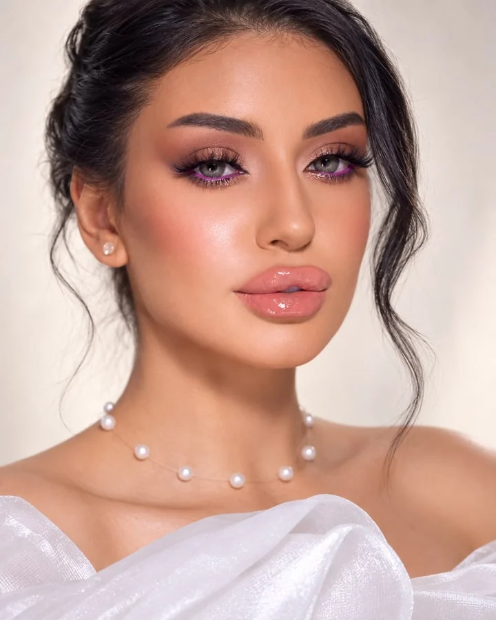 Bridal makeup with glossy lips and delicate pearl details